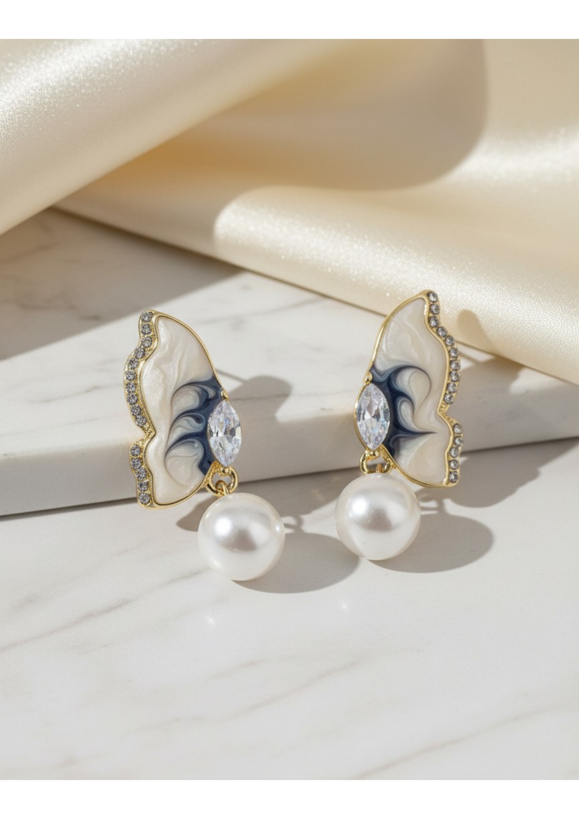 Butterfly-inspired pearl drop earrings. - Image 2
